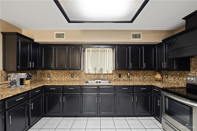 2315 E Sprague St, Edinburg, TX 78542 - kitchen featuring a sink, visible vents, light tile patterned flooring, and electric range