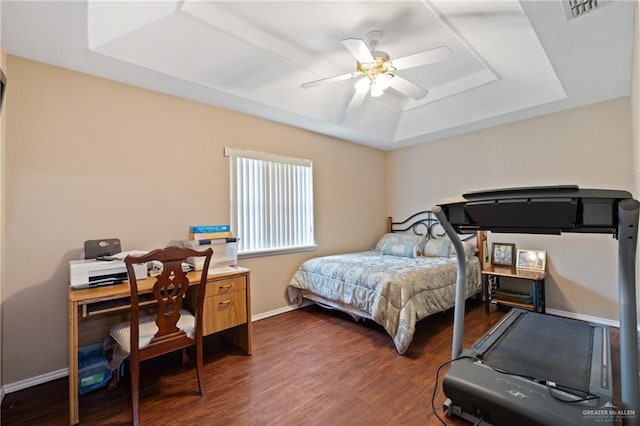 2315 E Sprague St, Edinburg, TX 78542 - bedroom featuring wood finished floors, visible vents, baseboards, a raised ceiling, and ceiling fan