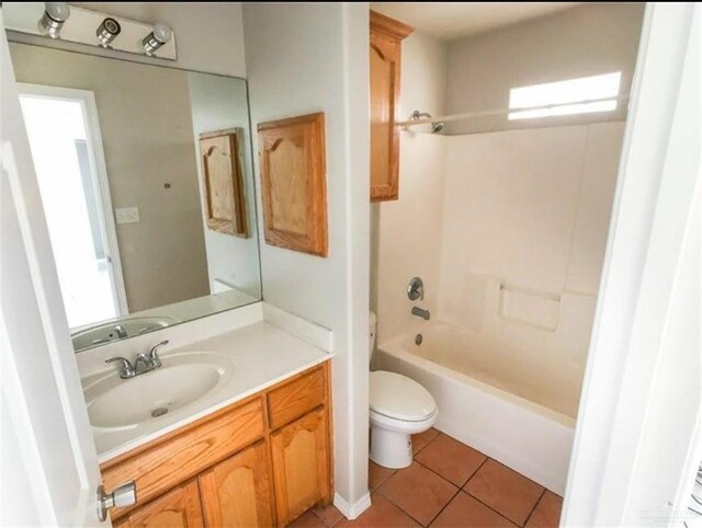 full bathroom featuring shower / bathing tub combination, toilet, vanity, plenty of natural light, and tile patterned floors