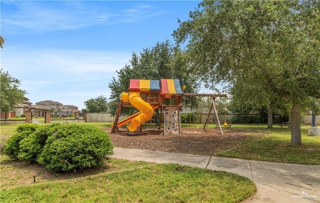 view of playground with a lawn