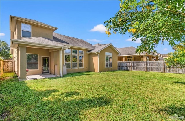 back of house with a yard