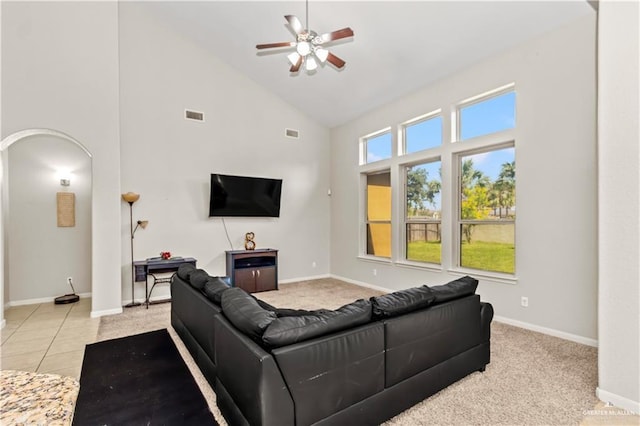 living room featuring tile patterned flooring, high vaulted ceiling, and ceiling fan