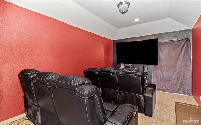 home theater featuring carpet and vaulted ceiling