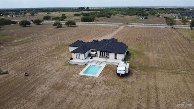 birds eye view of property with a rural view