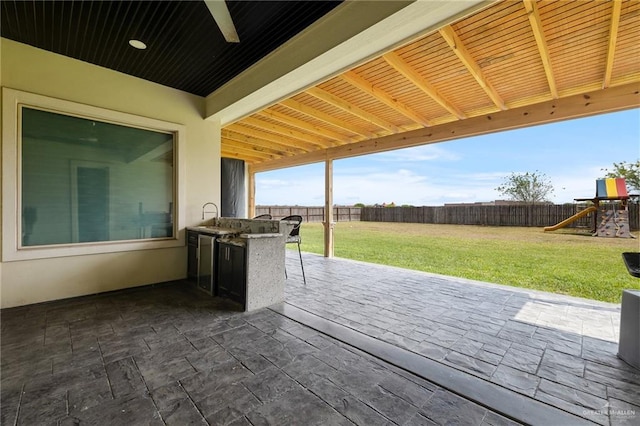 view of patio featuring a playground