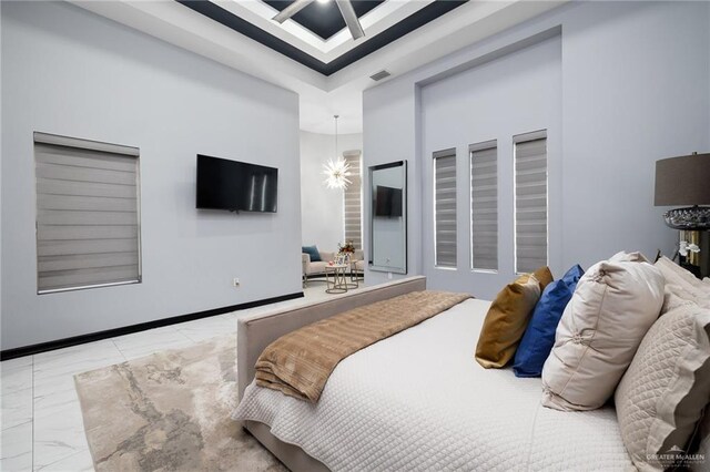 bedroom featuring an inviting chandelier