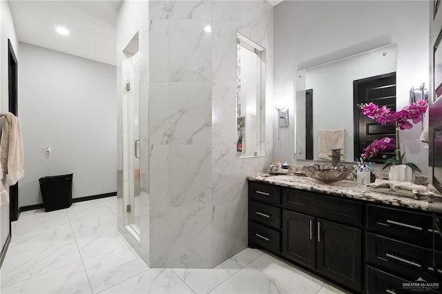 bathroom featuring vanity and a shower with shower door