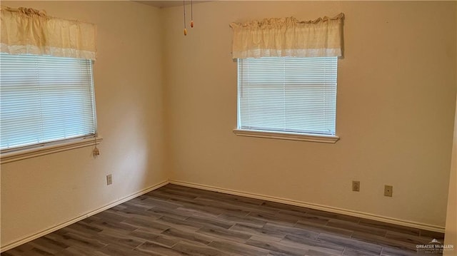 empty room featuring dark hardwood / wood-style floors