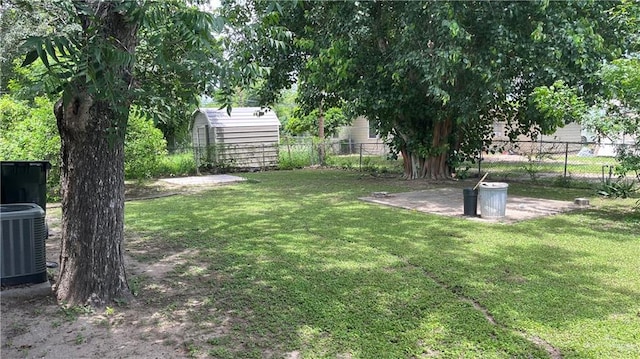 view of yard featuring an outbuilding and cooling unit