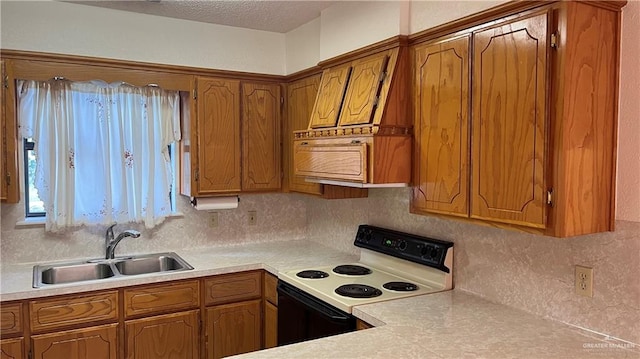 kitchen featuring a textured ceiling, tasteful backsplash, white electric stove, and sink