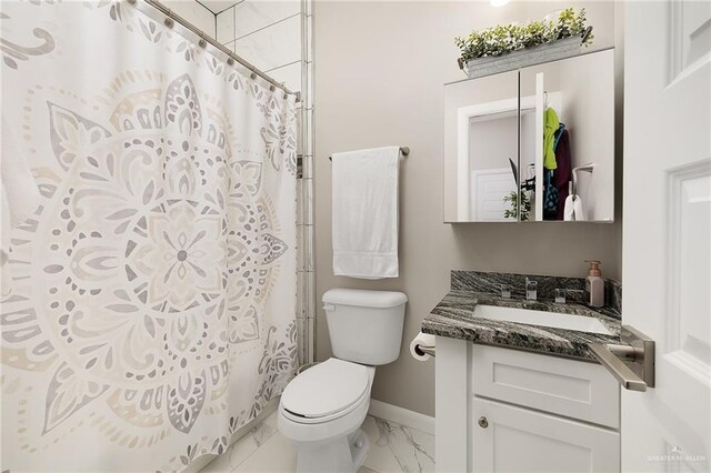 bathroom featuring baseboards, marble finish floor, toilet, curtained shower, and vanity