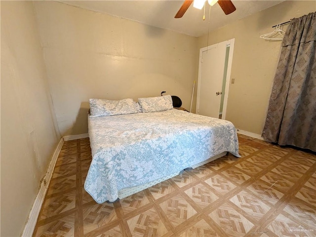 bedroom featuring parquet flooring and ceiling fan