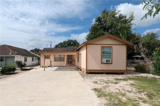 rear view of house featuring cooling unit