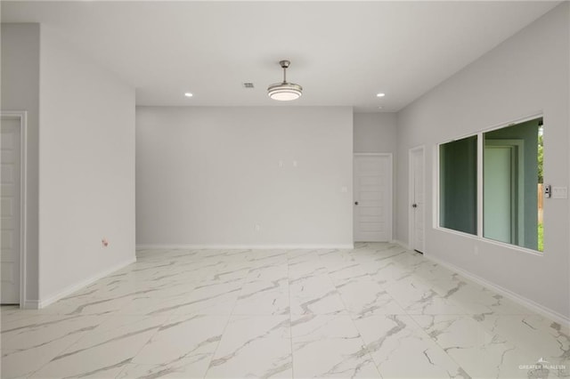 9218 N 25th St, Mcallen, TX 78504 - unfurnished room with recessed lighting, marble look tiles, and baseboards