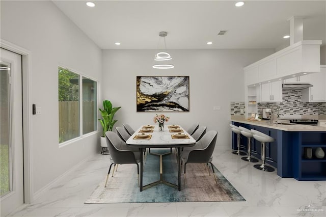9218 N 25th St, Mcallen, TX 78504 - dining area with light marble finish floors, recessed lighting, and baseboards