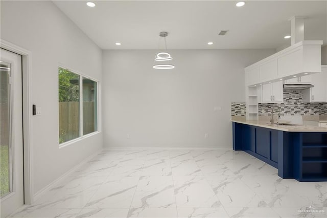 9218 N 25th St, Mcallen, TX 78504 - kitchen with open shelves, white cabinets, recessed lighting, blue cabinets, and baseboards