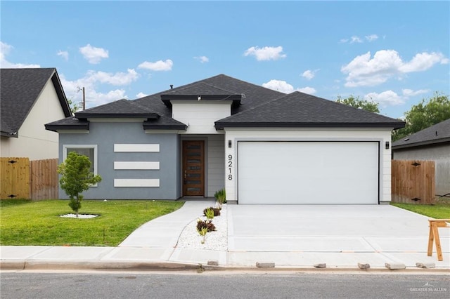 9218 N 25th St, Mcallen, TX 78504 - view of front of property with a garage, driveway, and roof with shingles