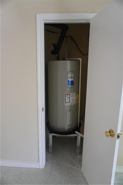 utility room featuring electric water heater