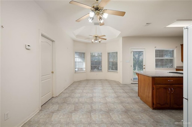 kitchen featuring ceiling fan and light tile patterned flooring