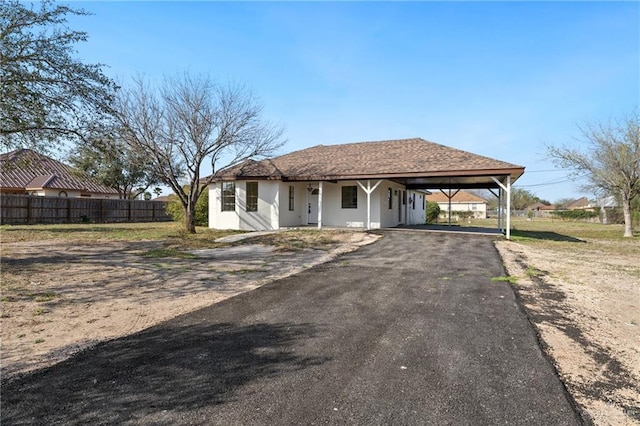 view of front facade with a carport