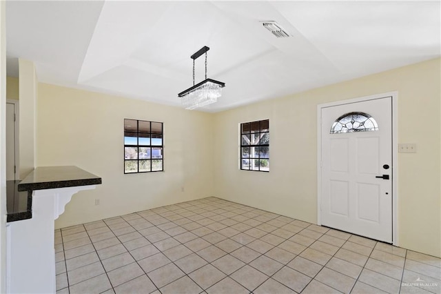 entryway with light tile patterned flooring