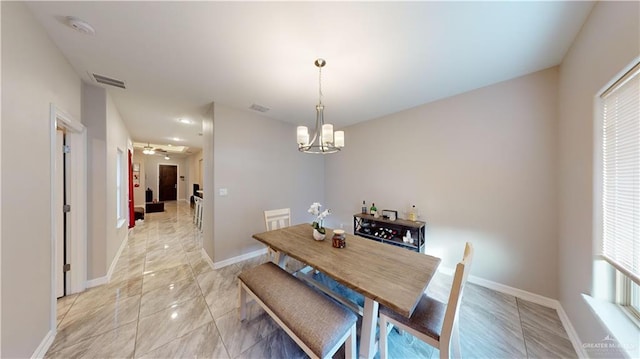 1003 Pear St W, Pharr, TX 78677 - dining room with baseboards and a chandelier