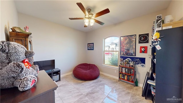 1003 Pear St W, Pharr, TX 78677 - home office with a ceiling fan, light marble finish floors, and baseboards