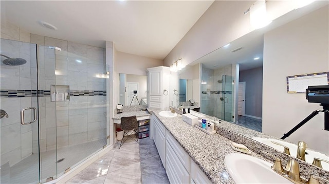 1003 Pear St W, Pharr, TX 78677 - bathroom with a stall shower, marble finish floors, double vanity, and vaulted ceiling