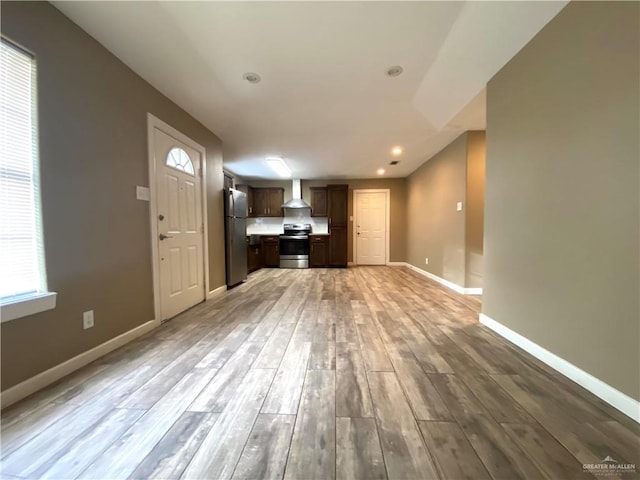 unfurnished living room featuring wood-type flooring