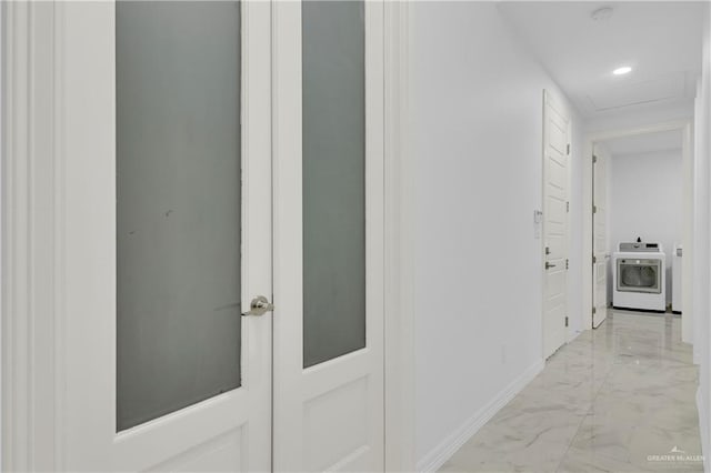 hall featuring recessed lighting, marble finish floor, baseboards, attic access, and washer / clothes dryer
