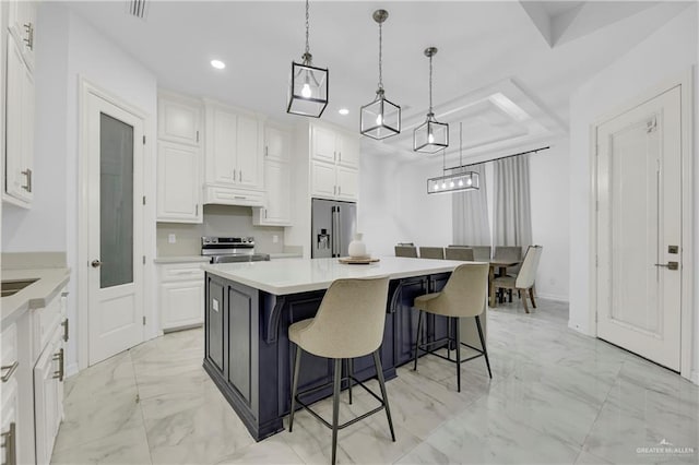 kitchen with white cabinets, marble finish floor, recessed lighting, and appliances with stainless steel finishes