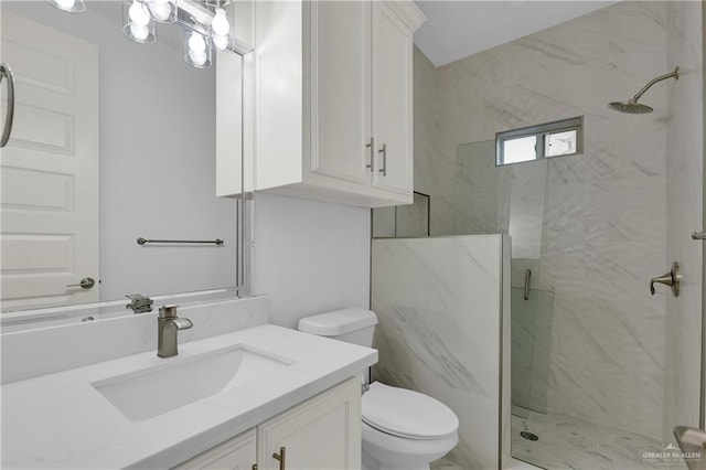 full bathroom featuring a notable chandelier, toilet, vanity, and a marble finish shower