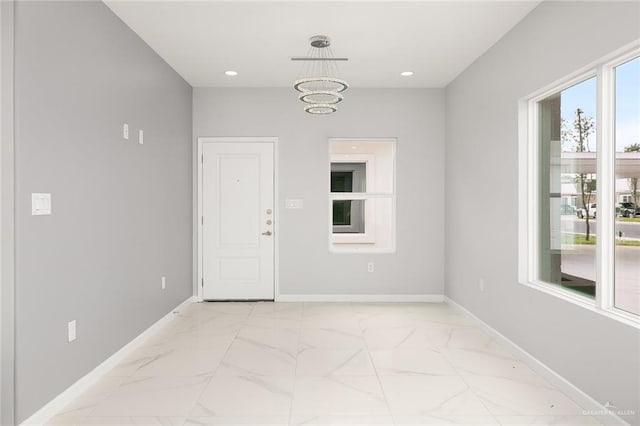 interior space featuring an inviting chandelier