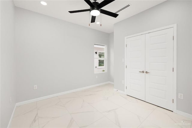 unfurnished bedroom featuring a closet and ceiling fan