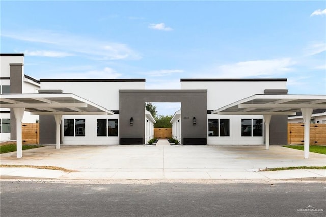 view of front of property featuring a carport