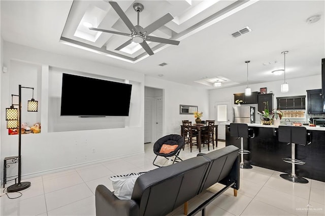 903 W Smith Dr, Pharr, TX 78577 - living room with light tile patterned floors, visible vents, and ceiling fan