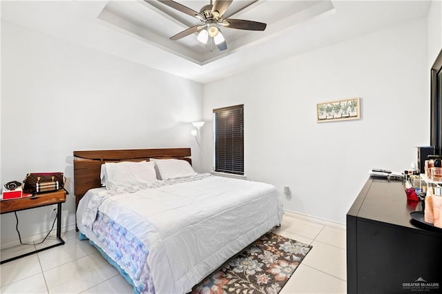 903 W Smith Dr, Pharr, TX 78577 - bedroom featuring a tray ceiling, ceiling fan, light tile patterned flooring, and baseboards
