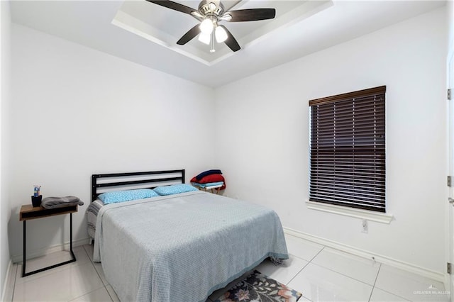 903 W Smith Dr, Pharr, TX 78577 - tiled bedroom with a tray ceiling, ceiling fan, and baseboards