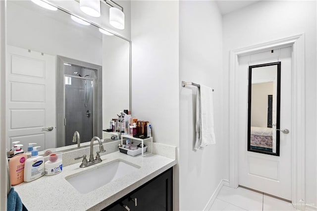 903 W Smith Dr, Pharr, TX 78577 - full bath with a stall shower, tile patterned flooring, vanity, and baseboards