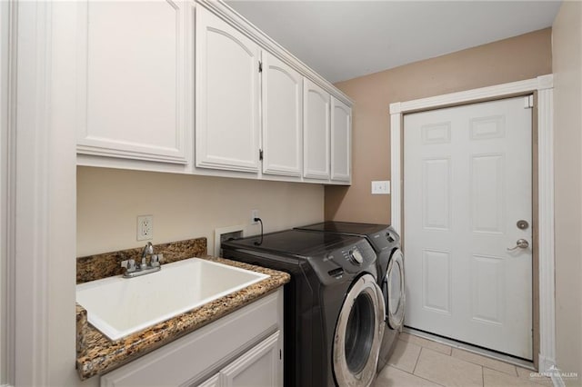 1614 Gabriels Lndg, Harlingen, TX 78550 - laundry area featuring cabinet space, independent washer and dryer, and light tile patterned flooring