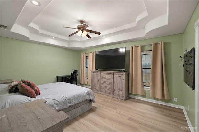 1614 Gabriels Lndg, Harlingen, TX 78550 - bedroom with a raised ceiling, light wood finished floors, ceiling fan, recessed lighting, and baseboards