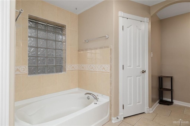 1614 Gabriels Lndg, Harlingen, TX 78550 - bathroom with a garden tub, tile patterned floors, and baseboards