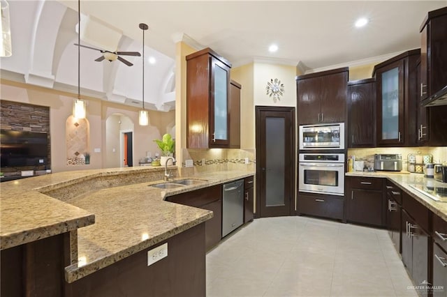 2000 Queens Ave, Mcallen, TX 78504 - kitchen featuring appliances with stainless steel finishes, a sink, light stone counters, ceiling fan, and decorative backsplash