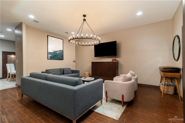 living room with baseboards, wood finish floors, visible vents, and recessed lighting