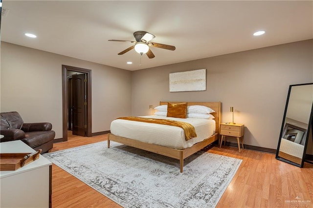 bedroom featuring a ceiling fan, recessed lighting, baseboards, and light wood finished floors