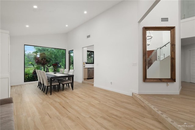 807 Cimarron Dr, Mission, TX 78572 - dining room with recessed lighting, light wood finished floors, baseboards, and high vaulted ceiling