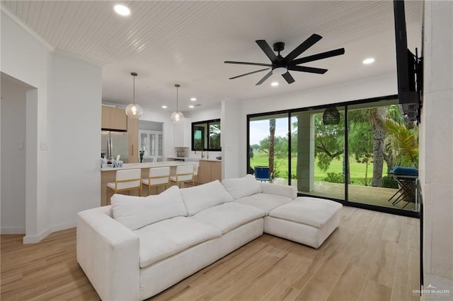 807 Cimarron Dr, Mission, TX 78572 - living area featuring recessed lighting, light wood-type flooring, a ceiling fan, crown molding, and baseboards
