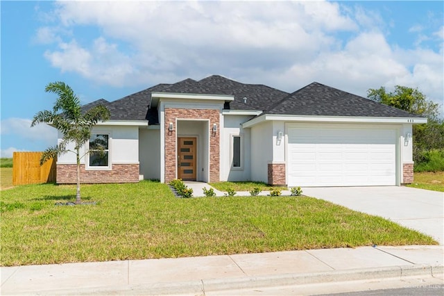 view of front facade with a front lawn and a garage