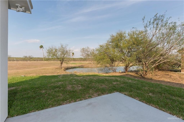 view of yard with a rural view