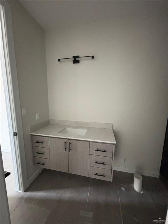 2213 Dorado Dr, Mission, TX 78573 - bathroom featuring vanity and baseboards
